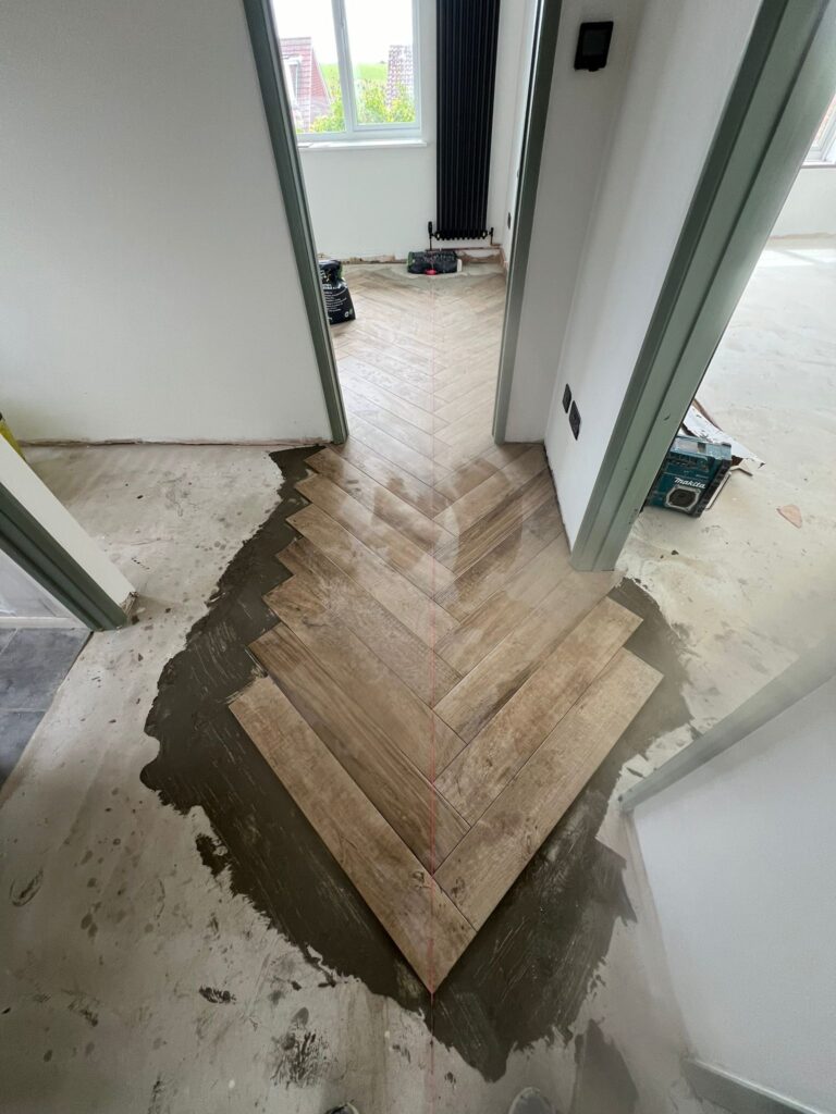 WhatsApp Image 2024-05-31 at 13.05.43 Herringbone Wood Effect Tiles